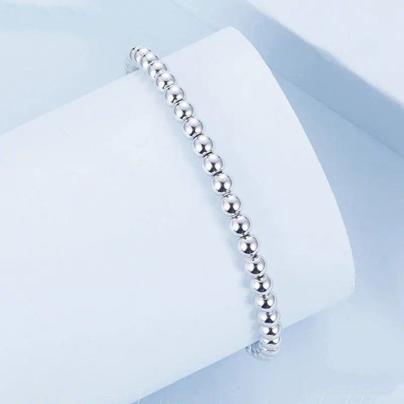 Bracelet boules de perles élastique extensible en or blanc