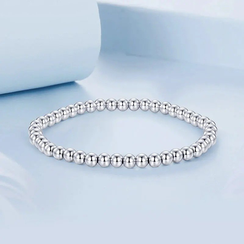 Bracelet boules de perles élastique extensible en or blanc